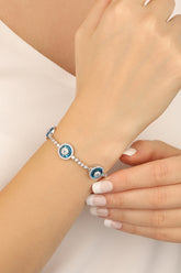 سوار فضي بثلاث عيون زجاجية