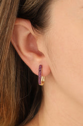 أقراط فضية مرصعة بحجر وردي