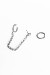 أقراط فضية متدلية بسلسلة من الأحجار الكبيرة