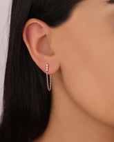 Triple Stones chain hangs from each needle that fixes to the back of the earrings