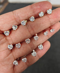 أقراط فضية بتصميم قلب من الحجر الأبيض