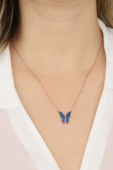 قلادة فراشة فضية بحجر أزرق داكن