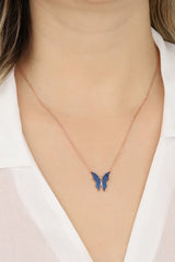 قلادة فراشة فضية بحجر أزرق داكن