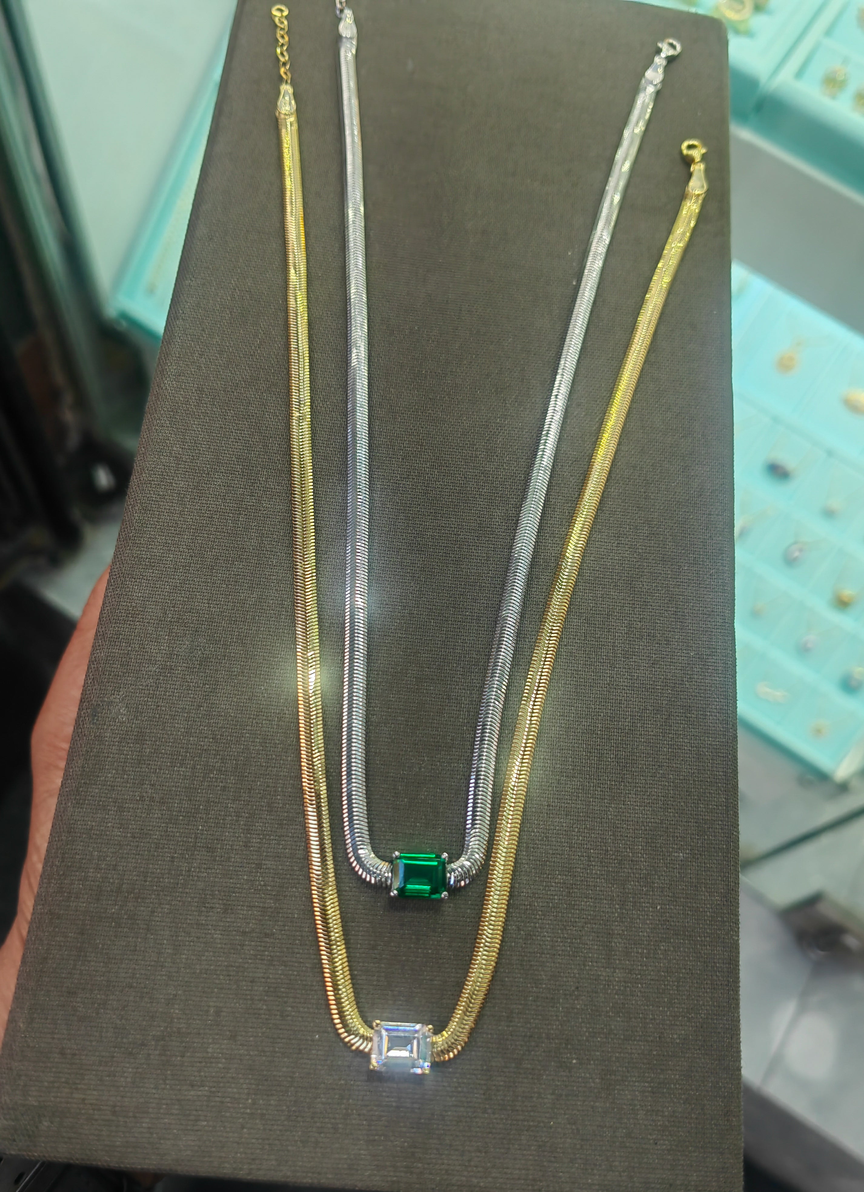 One Stone, Two Metals – Emerald Cut Green CZ Solitaire on Layered Silver Gold Herringbone Chain, Quiet Luxury Statement Necklace